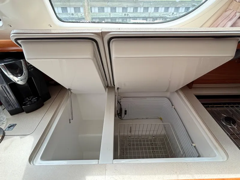 Slide: The Image of Open storage compartments on Jeanneau Sun Odyssey 43 DS yacht, 2001 model. - 30