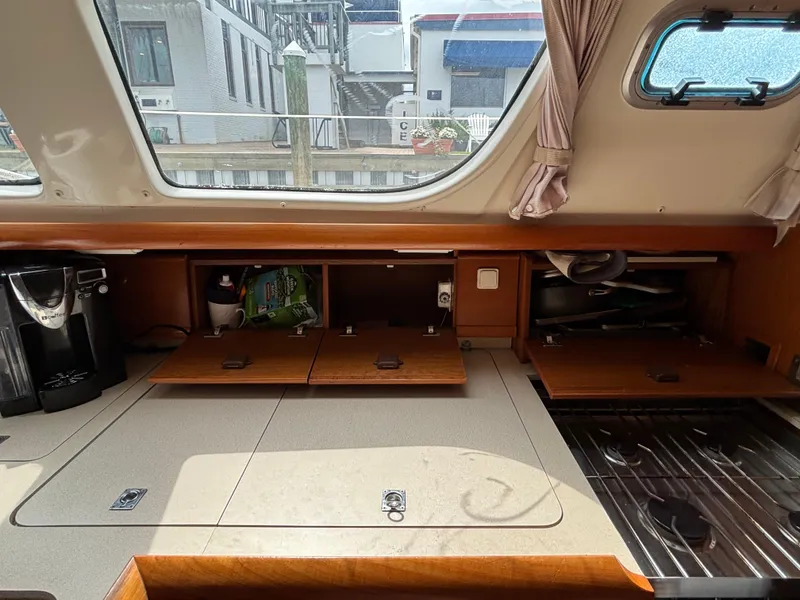 Slide: The Image of Interior of 2001 Jeanneau Sun Odyssey 43 DS sailboat with kitchen and storage areas. - 33