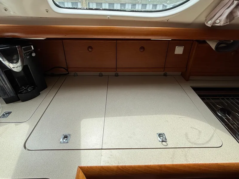 Slide: The Image of Interior of 2001 Jeanneau Sun Odyssey 43 DS yacht with countertop and coffee maker. - 34