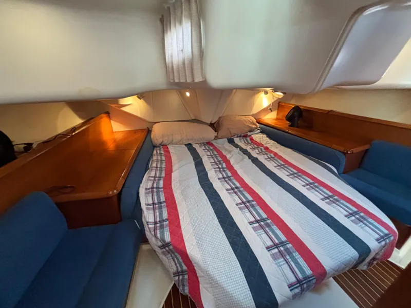 Slide: The Image of Cabin interior of 2001 Jeanneau Sun Odyssey 43 DS with cozy bed and seating. - 35