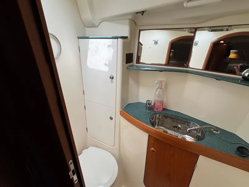 Slide: The Image of Bathroom interior of 2001 Jeanneau Sun Odyssey 43 DS yacht, featuring sink and storage. - 47