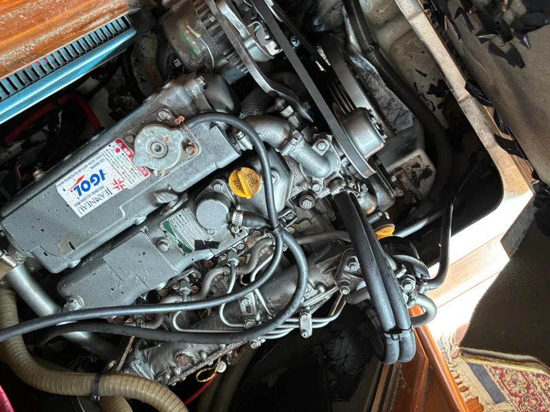 Slide: The Image of Engine of a 2001 Jeanneau Sun Odyssey 43 DS sailboat, showcasing mechanical components. - 48