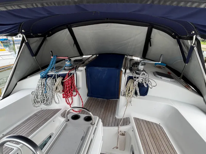 Slide: The Image of Cockpit of 2001 Jeanneau Sun Odyssey 43 DS sailboat with ropes and canopy. - 5