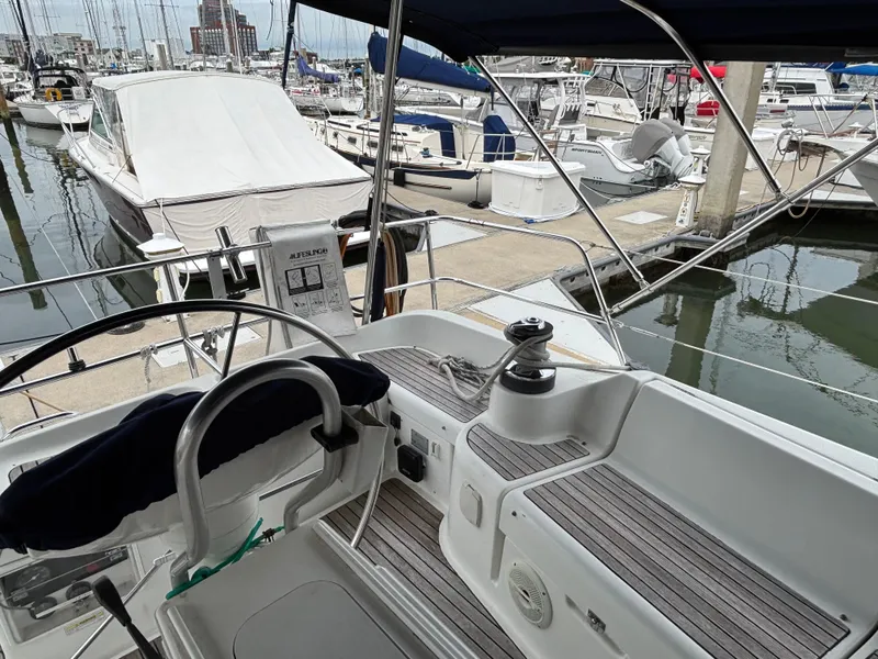 Slide: The Image of Cockpit view of 2001 Jeanneau Sun Odyssey 43 DS sailboat docked at marina. - 7