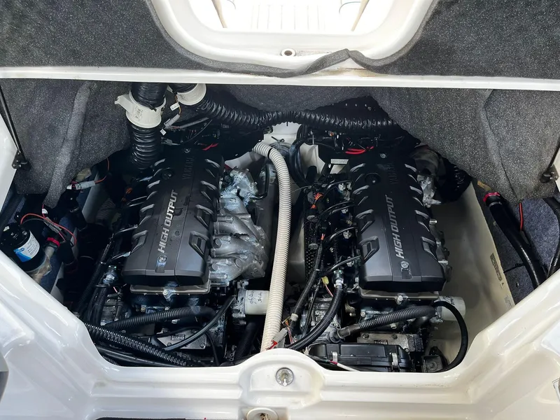 Slide: The Image of Engine compartment of a 2018 Yamaha Boats 242X E-Series, featuring dual high-output engines. - 19