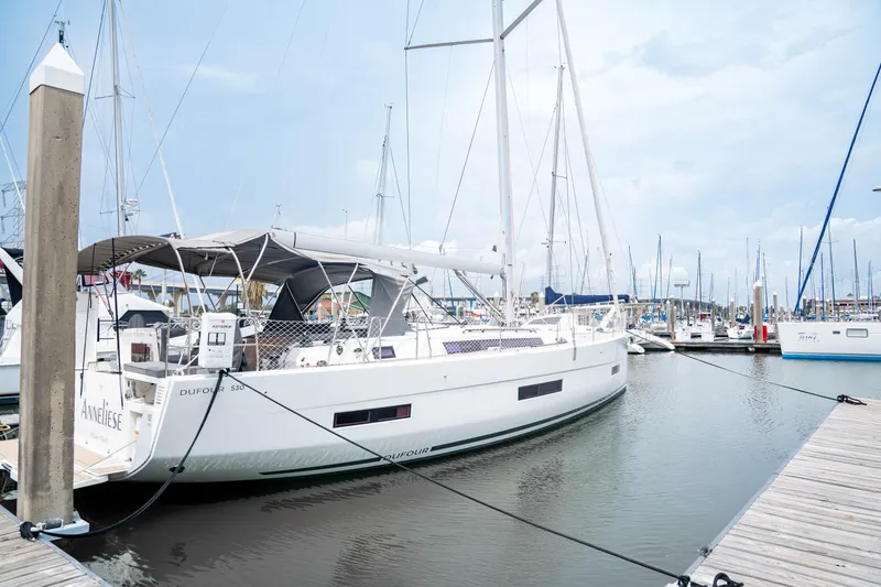 The Image of 2023 Dufour 530 yacht docked at marina, featuring sleek design and modern amenities. - 0