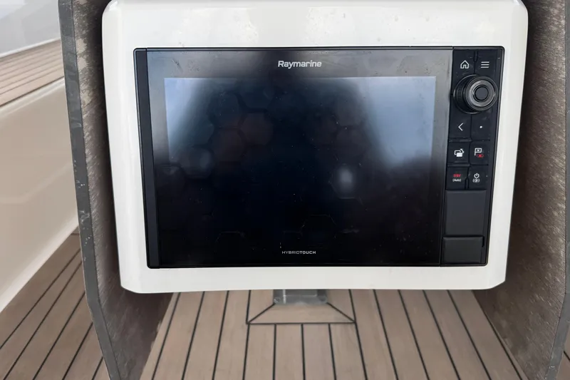 Slide: The Image of Raymarine navigation display on 2023 Dufour 530 yacht, featuring HybridTouch technology. - 14