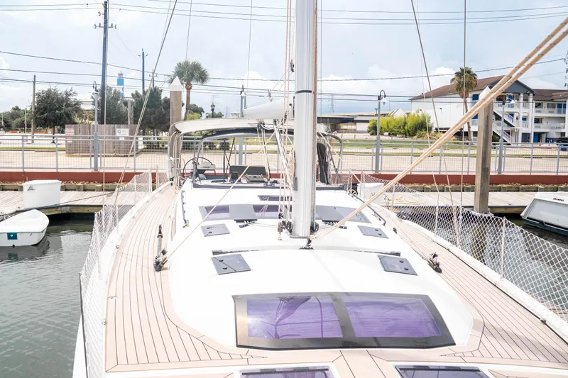 Slide: The Image of 2023 Dufour 530 yacht docked, showcasing sleek deck design and modern features. - 24