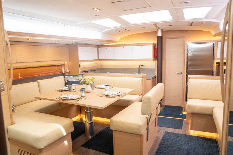Slide: The Image of Luxurious interior of 2023 Dufour 530 yacht with elegant dining area and modern kitchen. - 29