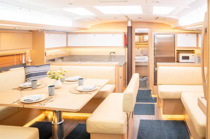 Slide: The Image of Luxurious interior of 2023 Dufour 530 yacht with elegant dining area and modern kitchen. - 33
