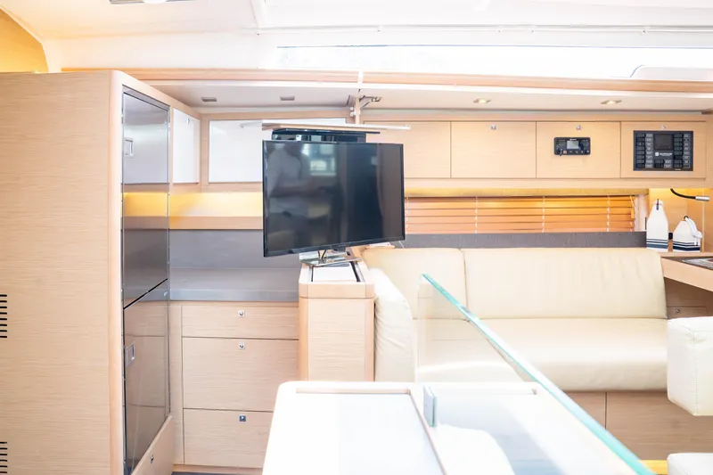 Slide: The Image of Modern interior of 2023 Dufour 530 yacht with sleek design and comfortable seating. - 36