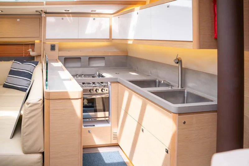 Slide: The Image of Modern kitchen interior of 2023 Dufour 530 yacht with sleek design and ample lighting. - 40