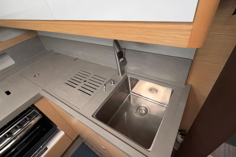 Slide: The Image of Modern kitchen sink in 2023 Dufour 530 yacht, featuring sleek stainless steel design. - 42