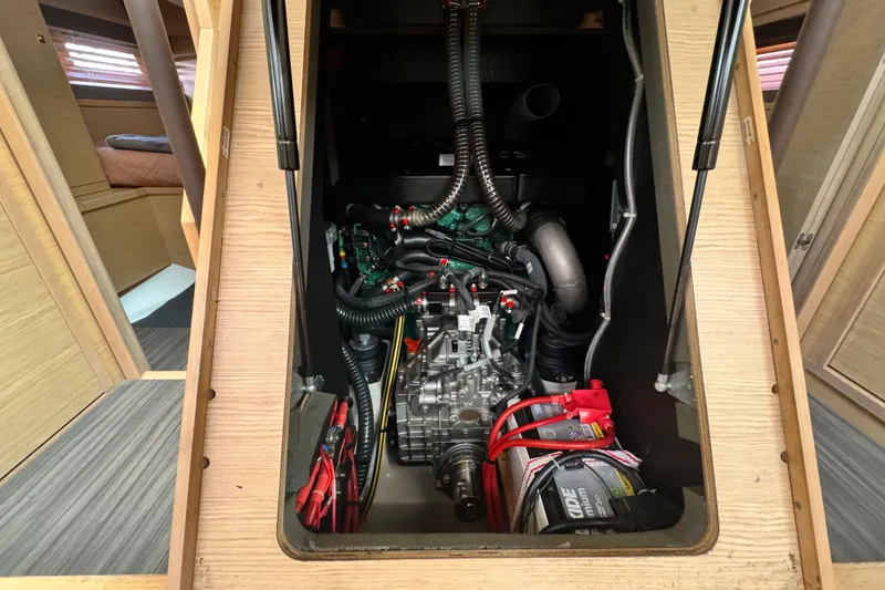 Slide: The Image of Engine compartment of 2023 Dufour 530 yacht, showcasing detailed mechanical components. - 58