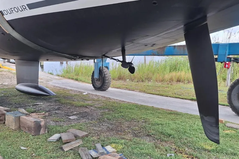 Slide: The Image of Underwater view of 2023 Dufour 530 sailboat hull and rudder on land. - 60