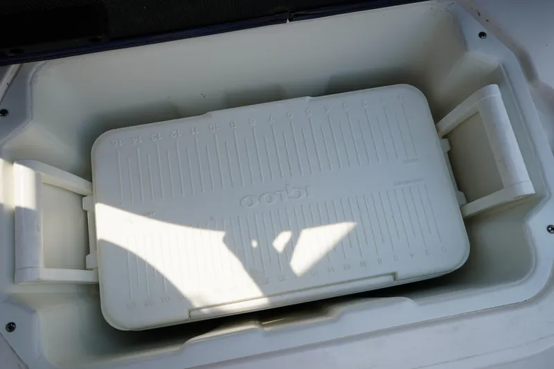 Slide: The Image of Built-in cooler on 2020 Chaparral 257 SSX boat, featuring a white insulated design. - 14