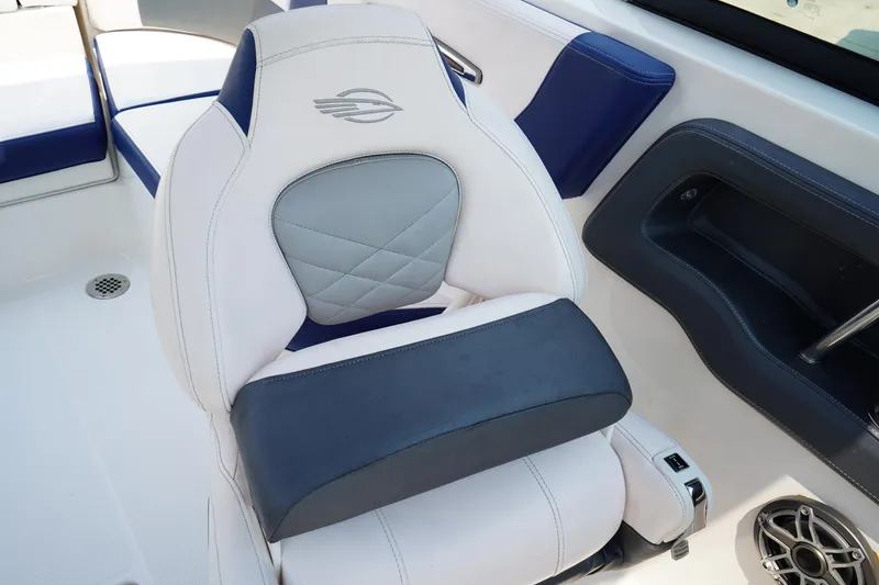 Slide: The Image of 2020 Chaparral 257 SSX boat seat with white and blue upholstery, featuring a stylish design. - 16
