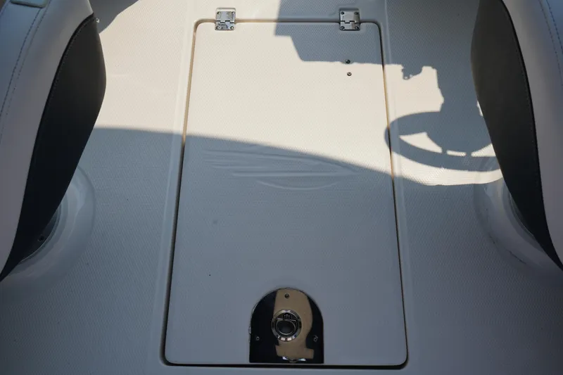 Slide: The Image of 2020 Chaparral 257 SSX boat floor compartment with latch and hinges. - 20