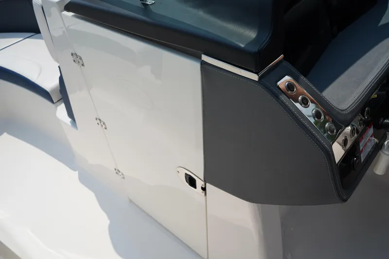 Slide: The Image of 2020 Chaparral 257 SSX boat dashboard with sleek design and modern controls. - 23