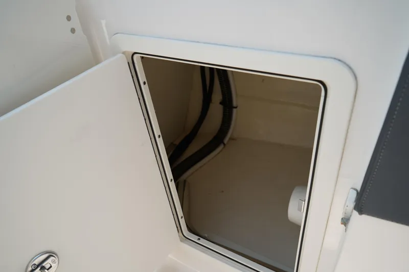 Slide: The Image of Open storage compartment on 2020 Chaparral 257 SSX boat. - 25