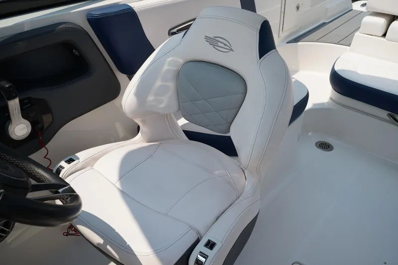 Slide: The Image of 2020 Chaparral 257 SSX boat interior with white and blue seating. - 26