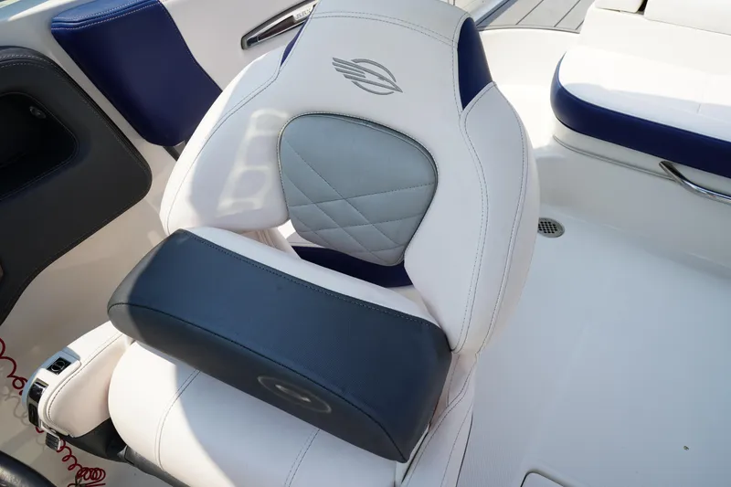 Slide: The Image of Luxury seating in 2020 Chaparral 257 SSX boat, featuring white and blue upholstery. - 27