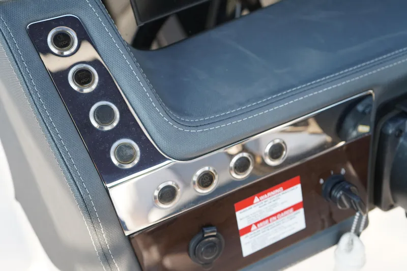 Slide: The Image of Control panel of 2020 Chaparral 257 SSX boat with switches and warning label. - 30