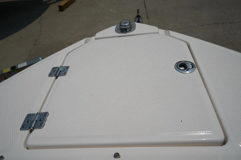 Slide: The Image of 2020 Chaparral 257 SSX boat deck with hatch and metal fittings. - 41