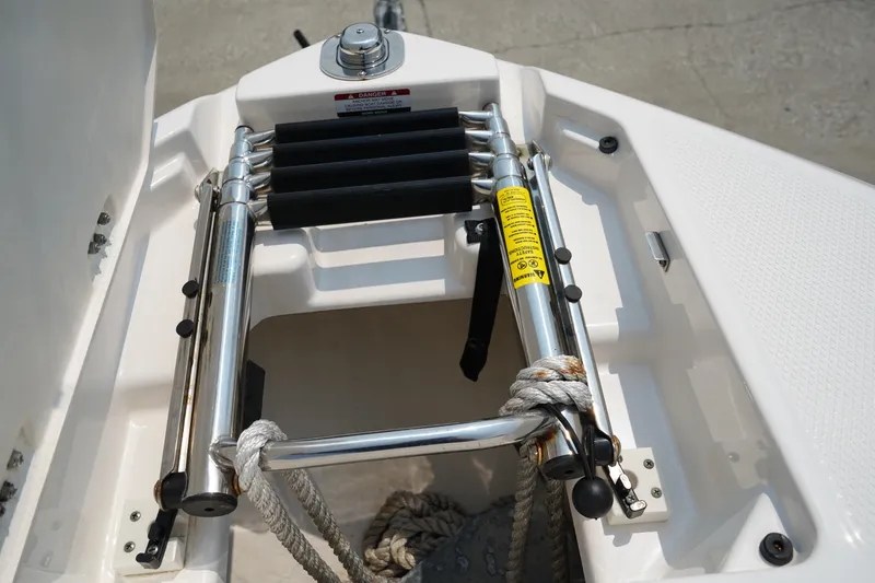 Slide: The Image of 2020 Chaparral 257 SSX boat ladder and anchor storage compartment. - 42