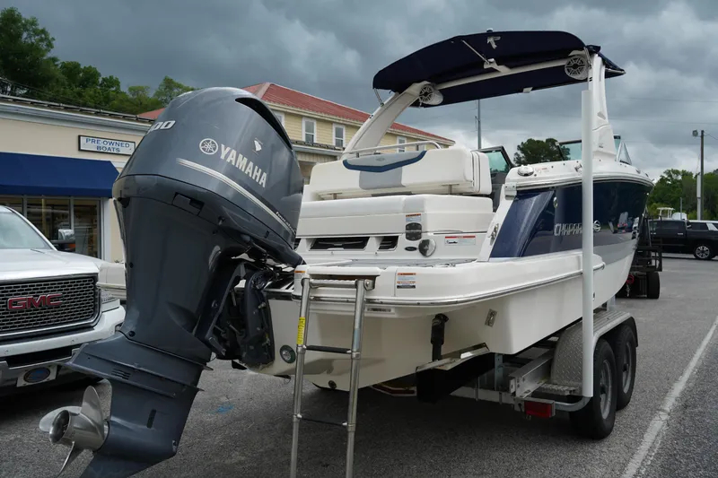 Slide: The Image of 2020 Chaparral 257 SSX boat with Yamaha engine on trailer, parked outdoors. - 5