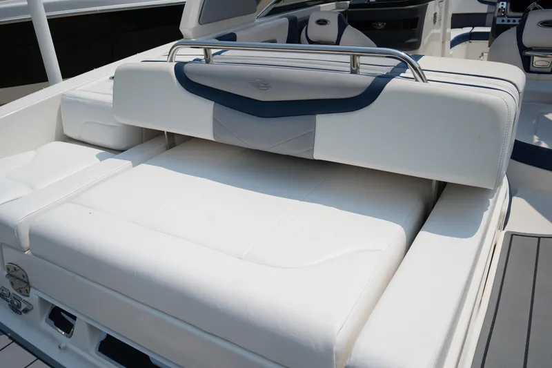 Slide: The Image of 2020 Chaparral 257 SSX boat with white cushioned seating and sleek design. - 7