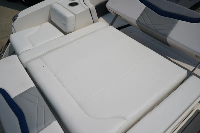 Slide: The Image of 2020 Chaparral 257 SSX boat with white cushioned seating and modern design. - 8