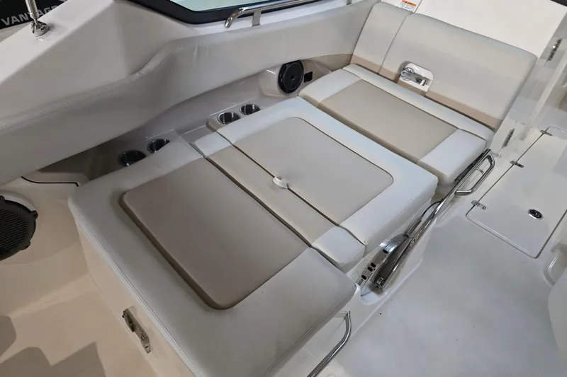 Slide: The Image of 2026 Boston Whaler 240 Vantage interior seating with cup holders and sleek design. - 10