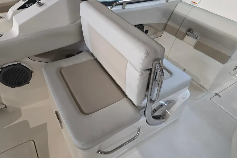 Slide: The Image of 2026 Boston Whaler 240 Vantage boat interior with cushioned seating and sleek design. - 11