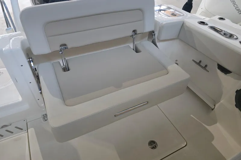 Slide: The Image of 2026 Boston Whaler 240 Vantage boat interior with foldable seating and storage. - 12