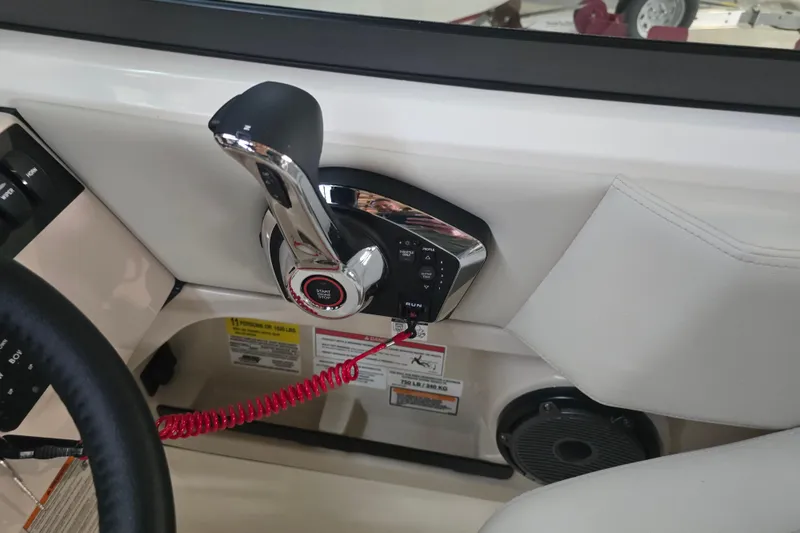Slide: The Image of Control panel of 2026 Boston Whaler 240 Vantage boat with throttle and start button. - 6