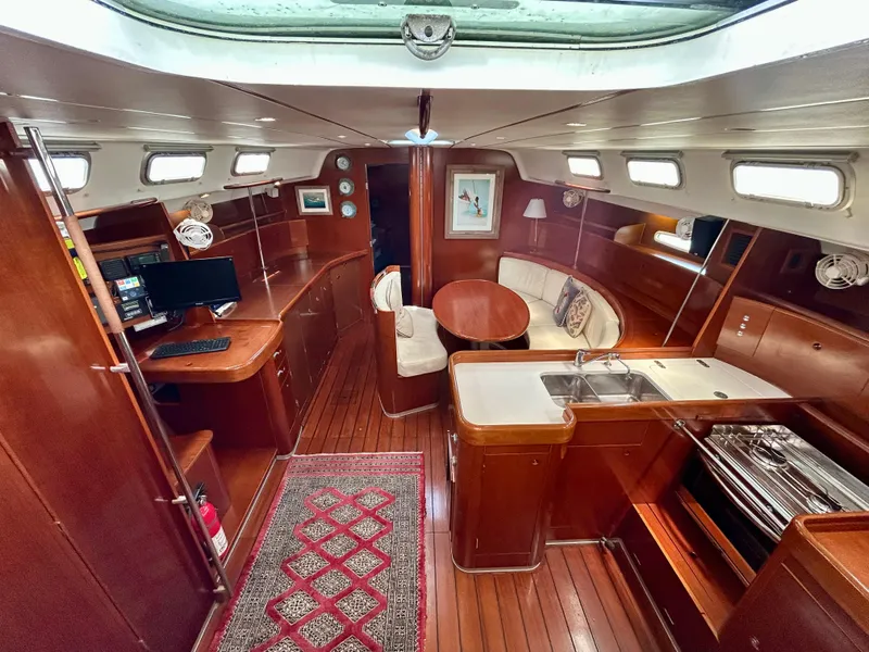 Slide: The Image of Luxurious interior of 2003 Beneteau First 47.7 yacht with wood finish and modern amenities. - 14