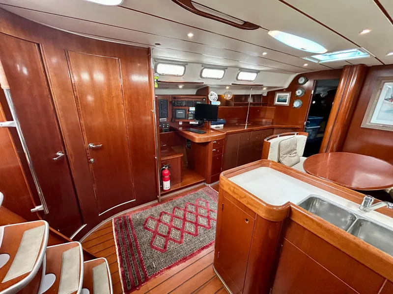Slide: The Image of Interior of 2003 Beneteau First 47.7 yacht with wood finish and modern amenities. - 19