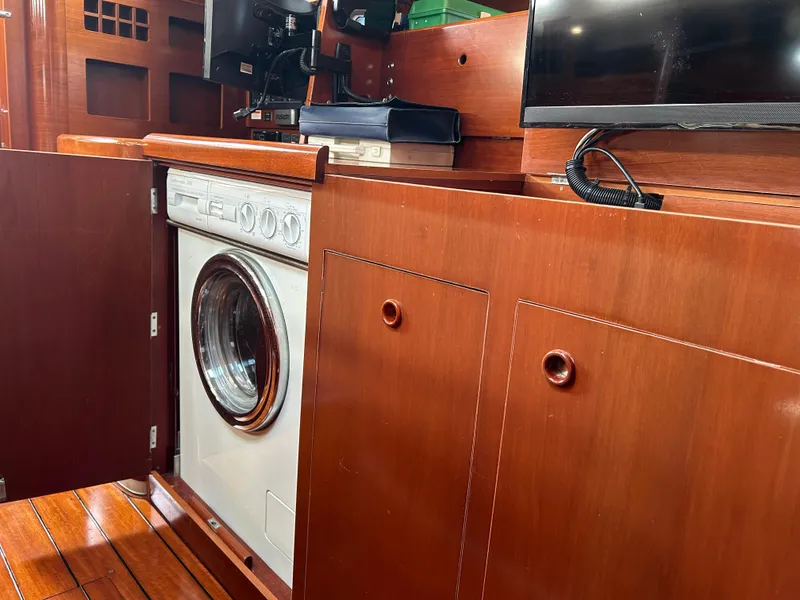 Slide: The Image of Interior of 2003 Beneteau First 47.7 yacht with built-in washing machine. - 23