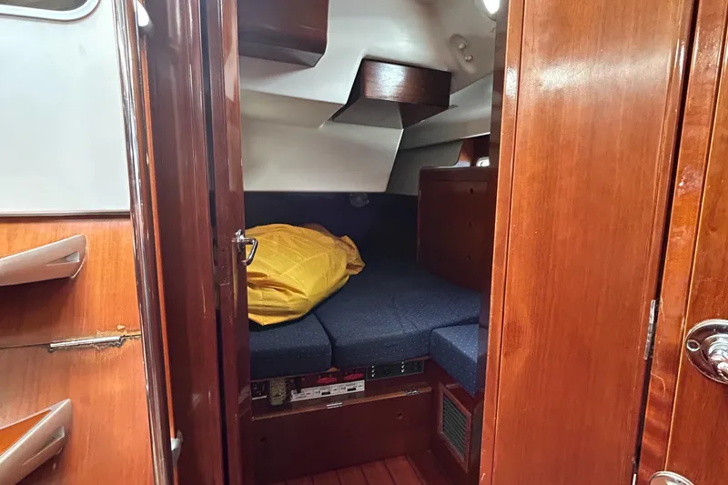 Slide: The Image of Cozy cabin interior of 2003 Beneteau First 47.7 sailboat with wooden finish. - 27