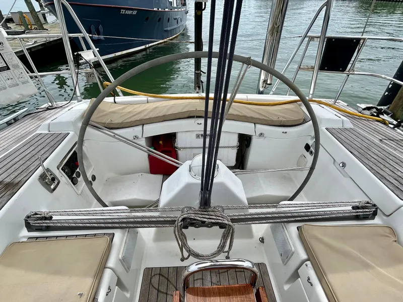 Slide: The Image of Cockpit of 2003 Beneteau First 47.7 sailboat with steering wheel and seating. - 9