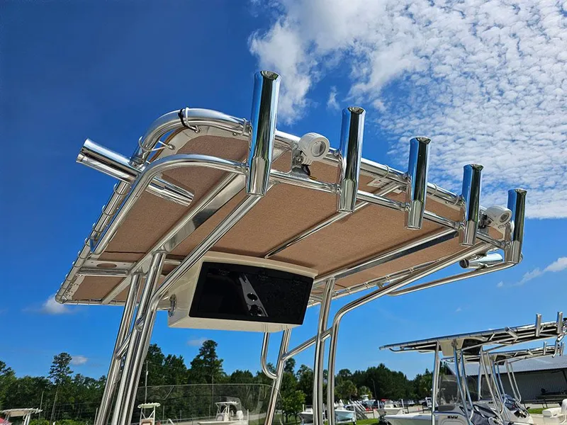 Slide: The Image of 2025 Pioneer 202 Islander boat with T-top and rod holders against a blue sky. - 18