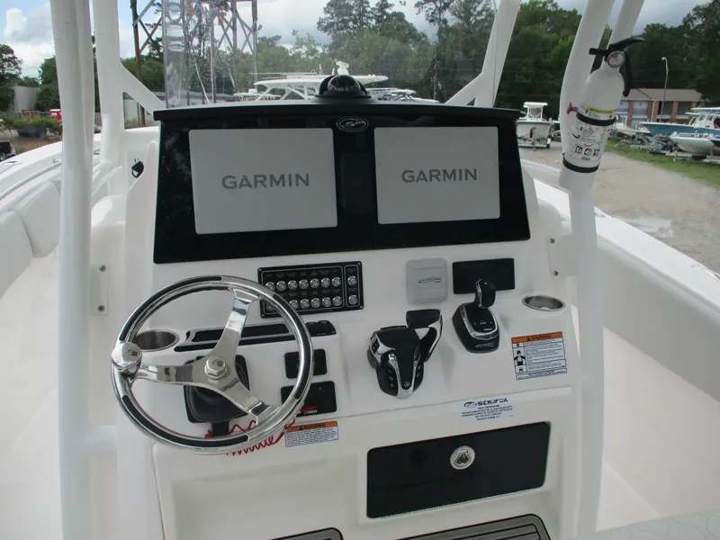 Slide: The Image of 2022 Sea Fox 288 Commander helm with Garmin displays and steering wheel. - 10