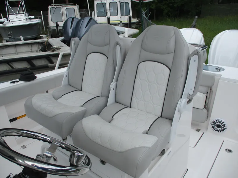 Slide: The Image of 2022 Sea Fox 288 Commander boat seats, featuring luxurious gray upholstery and ergonomic design. - 11