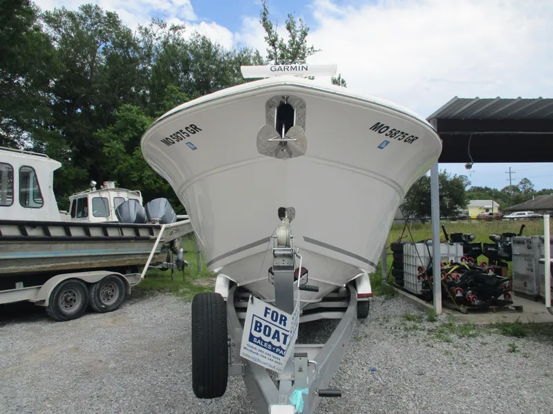Slide: The Image of 2022 Sea Fox 288 Commander boat on trailer, front view, parked outdoors. - 3