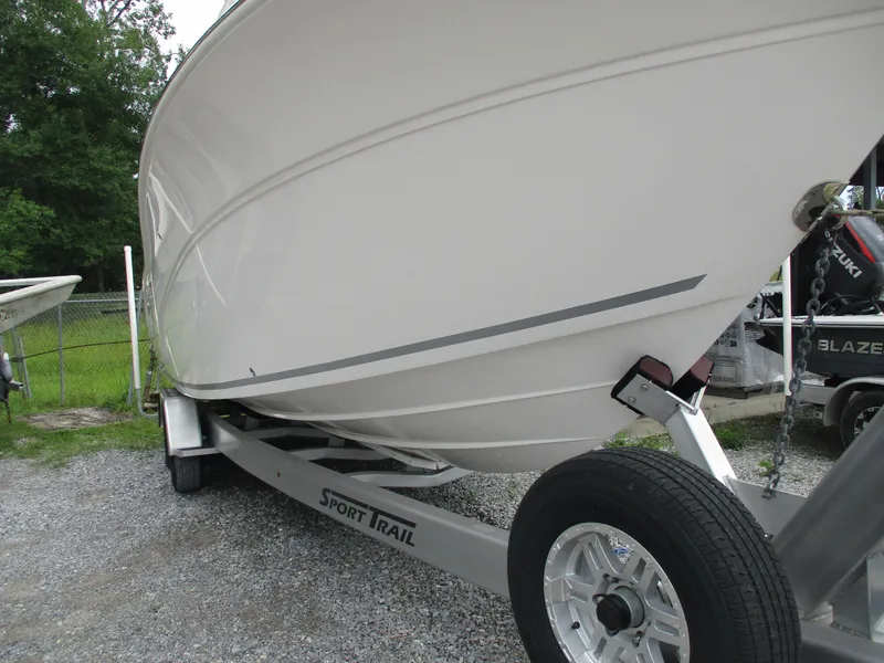 Slide: The Image of 2022 Sea Fox 288 Commander boat on Sport Trail trailer, parked on gravel. - 4