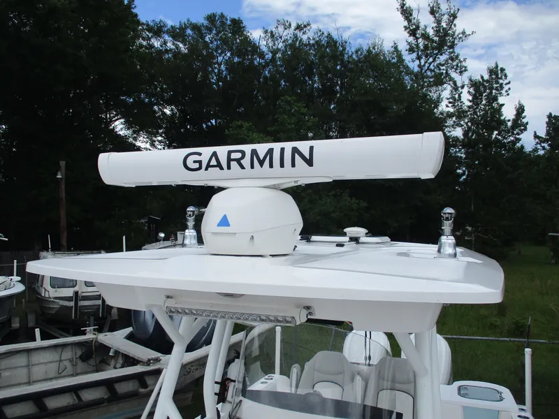 Slide: The Image of 2022 Sea Fox 288 Commander with Garmin radar, surrounded by trees and boats. - 7