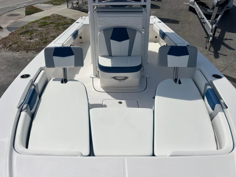 Slide: The Image of 2025 Robalo 226 Cayman boat interior with cushioned seating and modern design. - 11
