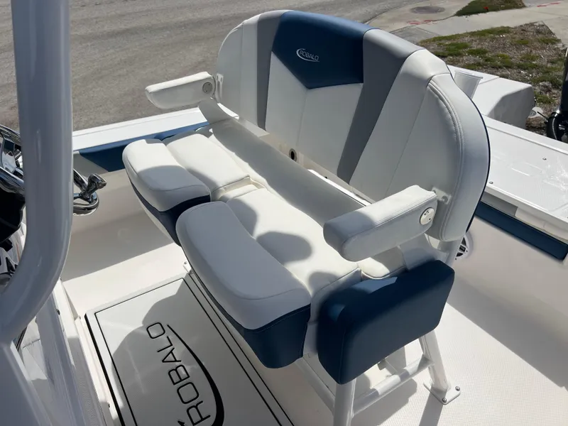 Slide: The Image of 2025 Robalo 226 Cayman boat seating with blue and white upholstery. - 14