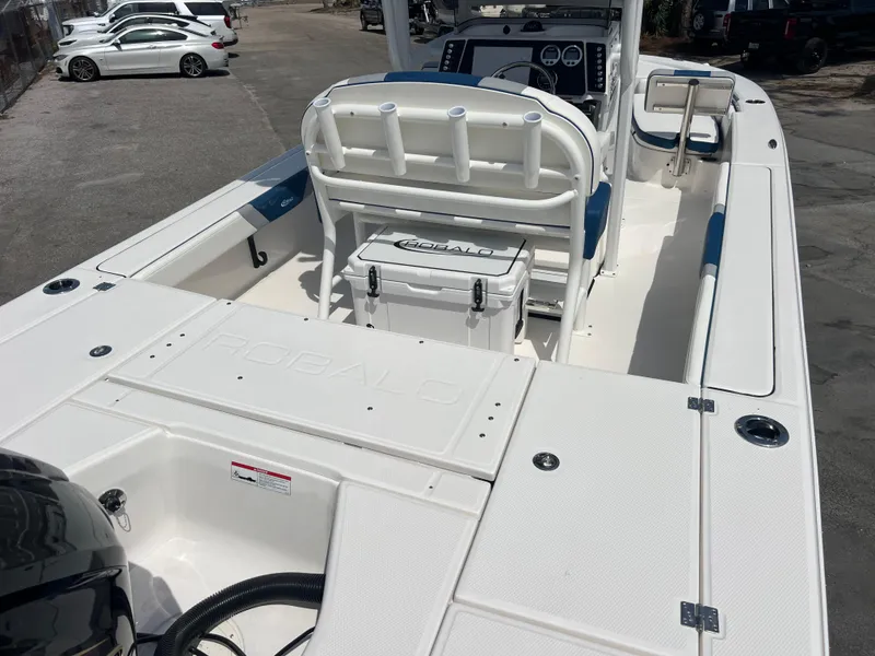 Slide: The Image of 2025 Robalo 226 Cayman boat interior with seating and storage compartments. - 6